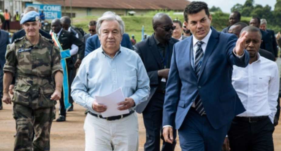 UN chief Antonio Guterres L promised continued blue helmet support for the Congolese army.  By ALEXIS HUGUET AFP