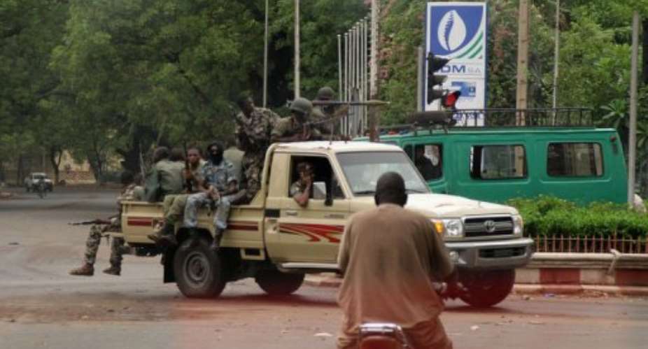 Soldiers drive around a roundabout in central Bamako in May 2012.  By Habibou Kouyate (AFP/File)