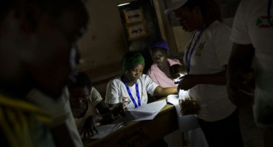 Staff from the independent national electoral commission count ballots in the Kinama neighbourhood in Bujumbura, on June 29, 2015.  By Phil Moore AFPFile