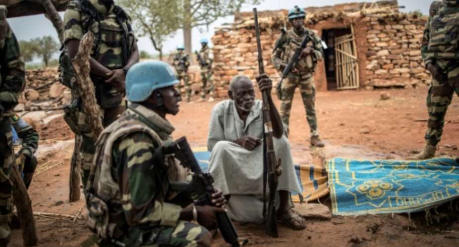 UN peacekeepers have been on the ground since 2013. Members of the 13,000-strong MINUSMA force are shown here in central Mali's Dogon region.  By Marco LONGARI AFPFile