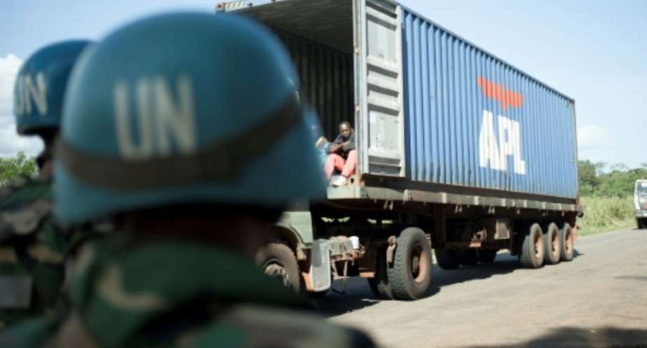 UN peacekeeprs count trucks passing along the corridor, the only supply road to Bangui, the isolated capital in the heart of the Central African Republic.  By FLORENT VERGNES AFP