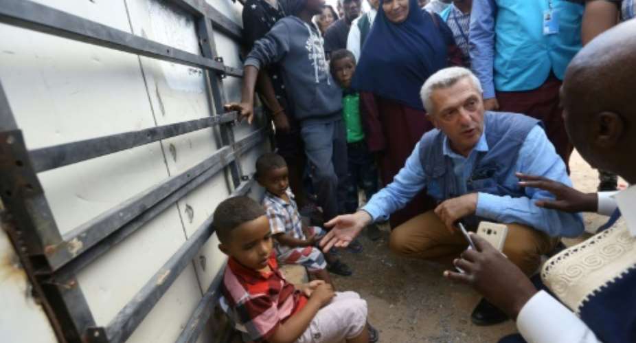UN refugee chief Filippo Grandi 2e D visits a camp for the displaced near the Libyan capital Tripoli.  By MAHMUD TURKIA AFP