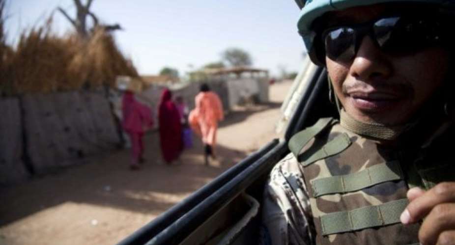 Thai peacekeepers on patrol in Muhkjar in western Darfur.  By Albert Gonzalez Farran (AFP/UNAMID/File)
