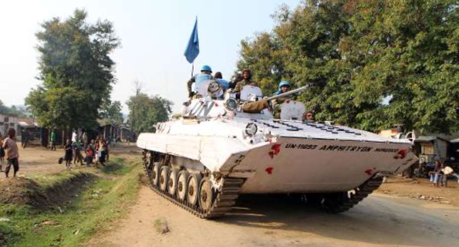 This picture taken on August 4, 2013 shows peacekeepers from the MONUSCO mission in the Democratic Republic of Congo patrolling the town of Kiwanja.  By Stephanie Aglietti AFPFile