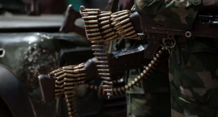 A chain of bullets hang from the butt of a rifle of a Congolese National Army soldier in Minova, on November 26, 2012.  By Phil Moore AFPFile