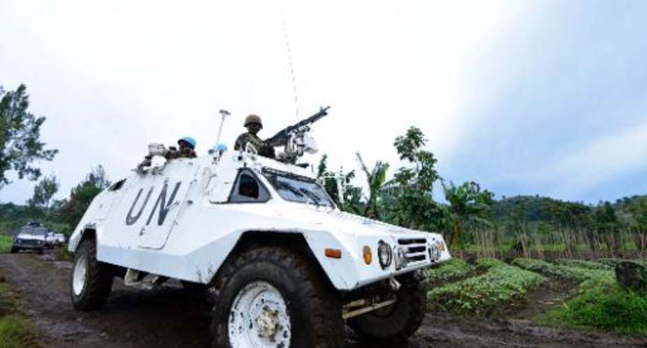 A UN mission in DR Congo MONUSCO armored personnel carrier patrols on November 5, 2013 on Chanzu hill, in the eastern North Kivu region.  By Junior D. Kannah AFPFile