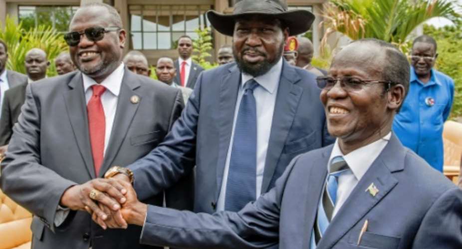 From L First Vice President of South Sudan Riek Machar, President Salva Kiir and Second Vice President of James Wani Igga after the formation of the new cabinet of the Transitional Government  in Juba on April 29, 2016.  By Charles Lomodong AFPFile