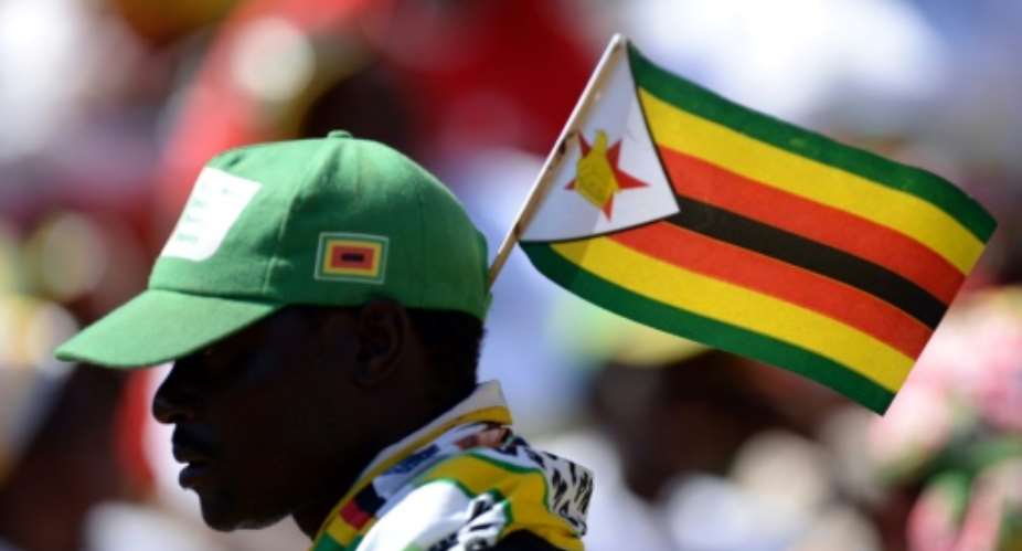 Under long-time leader President Robert Mugabe, 93, Zimbabwe has suffered mass unemployment, a collapse of many public services and banknote shortages as foreign investors have fled.  By ALEXANDER JOE AFPFile