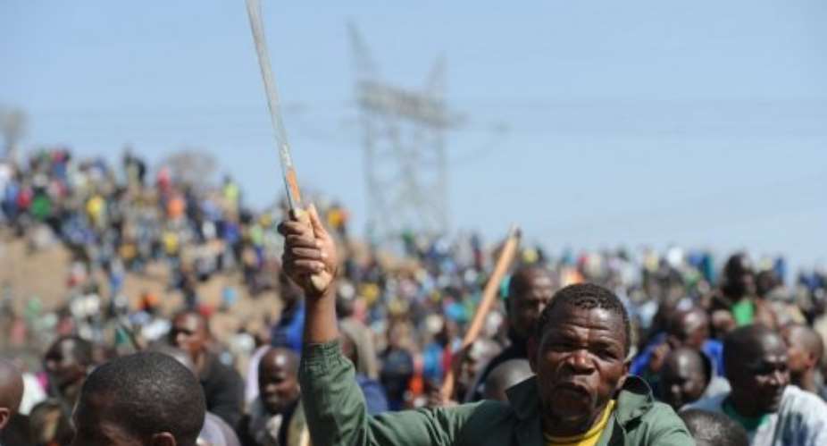 Police said the workers were advancing on them with guns and machetes.  By Stringer (AFP)