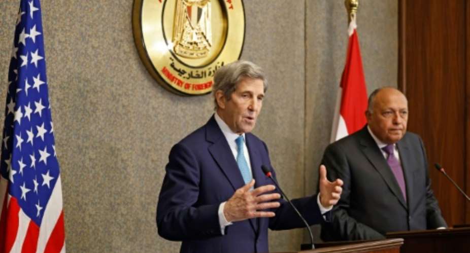 United States climate envoy John Kerry, on the left, and Egypt's Foreign Minister Sameh Shoukri hold a joint press conference in the capital Cairo, on February 21, 2022.  By Khaled DESOUKI AFP