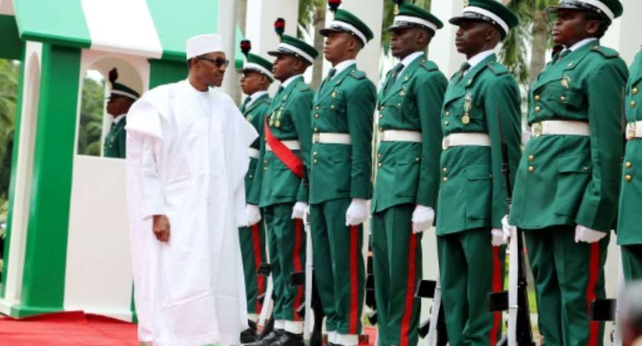 Nigerian president Mohammadu Buhari L deplores unruliness.  By Philip Ojisua AFPFile