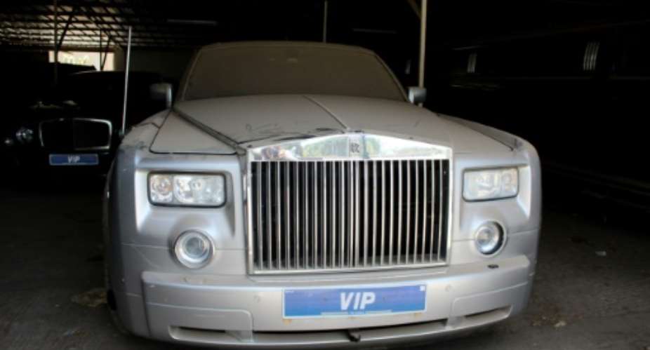 Up for grabs: One of former president Jammeh's Rolls-Royces. His fleet of luxury cars and presidential jets is being sold to raise money for health and education.  By CLAIRE BARGELES AFP