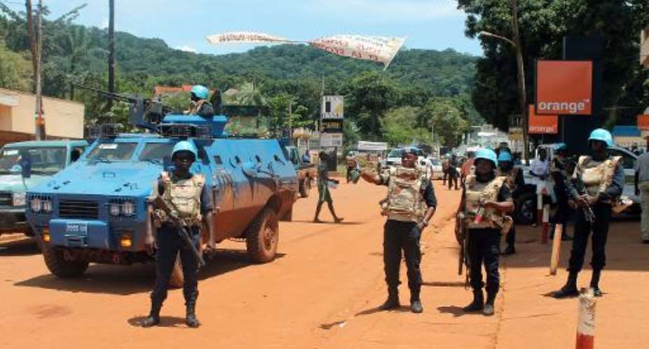 United Nations peacekeepers are seen stationed in the center of the Central African Republic capital Bangui, on October 8, 2014.  By Pacome Pabamdji AFP