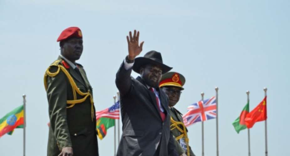 The US circulated a draft UN Security Council resolution proposing an arms embargo and targeted sanctions against South Sudan if President Salva Kiir, C, refuses to sign a peace accord ending the country's civil war.  By Samir Bol AFPFile