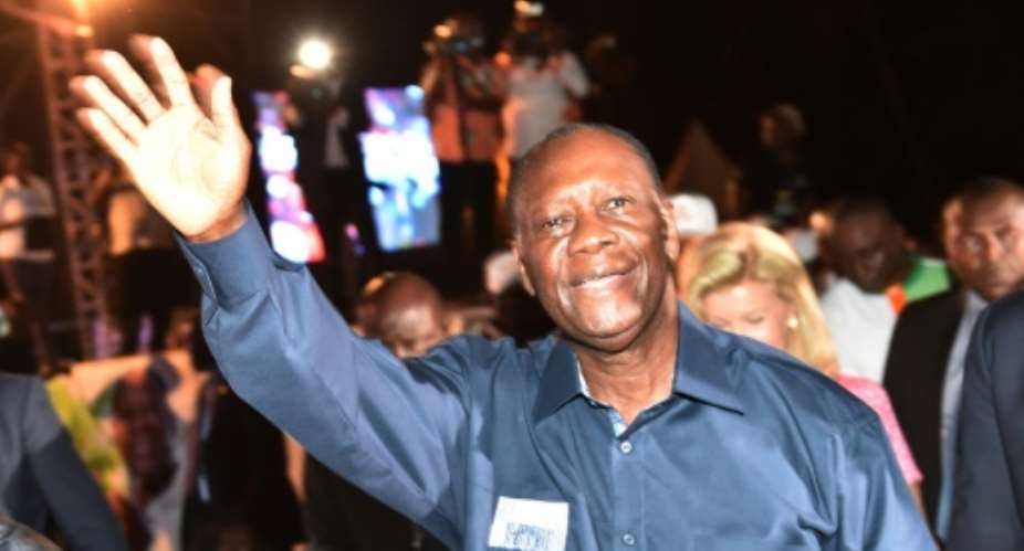 Ivory Coast president Alassane Ouattara  waves to supporters after his victory in the presidential election on October 28, 2015 in Abidjan.  By Issouf Sanogo AFP