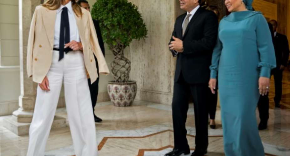 US First Lady Melania Trump L is welcomed by Egyptian President Abdel Fattah al-Sisi C and his wife Intissar Amer R upon arrival at the Presidential palace in the Egyptian capital Cairo.  By DOUG MILLS POOLAFP