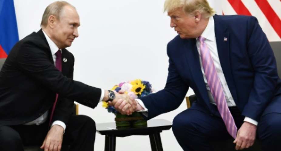US President Donald Trump meets Russian President Vladimir Putin at the G20 summit in Osaka.  By Brendan Smialowski AFP