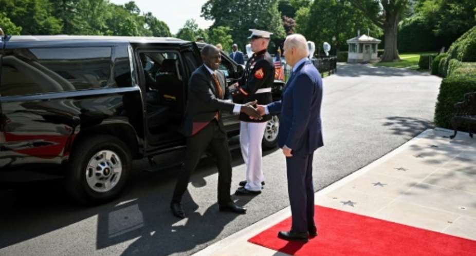 US President Joe Biden greets Kenya's President William Ruto upon his arrival at the South Portico of the White House.  By Mandel NGAN (AFP)