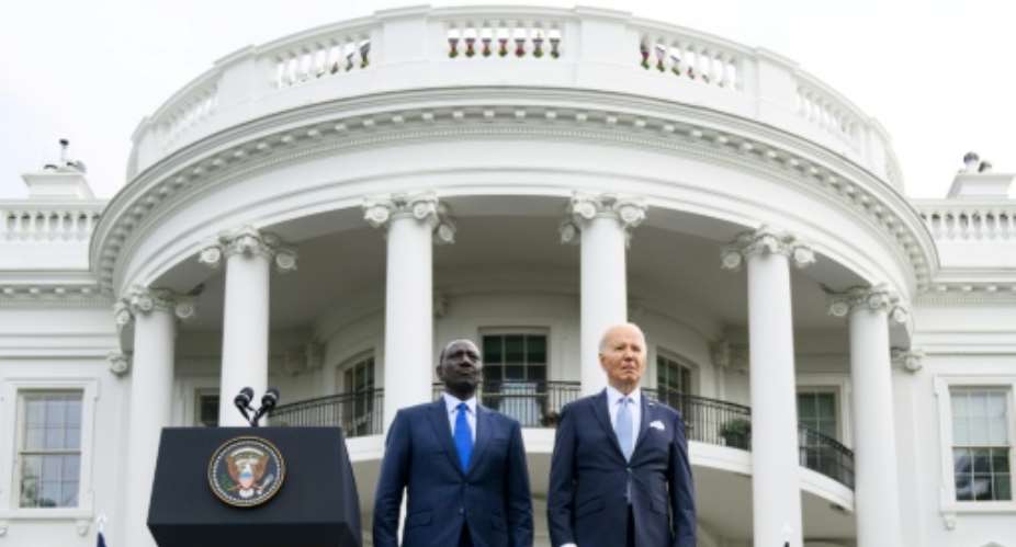 US President Joe Biden (R) and Kenya's President William Ruto stand as national anthems are played during an official arrival ceremony on the South Lawn of the White House in Washington, DC.  By Mandel NGAN (AFP)