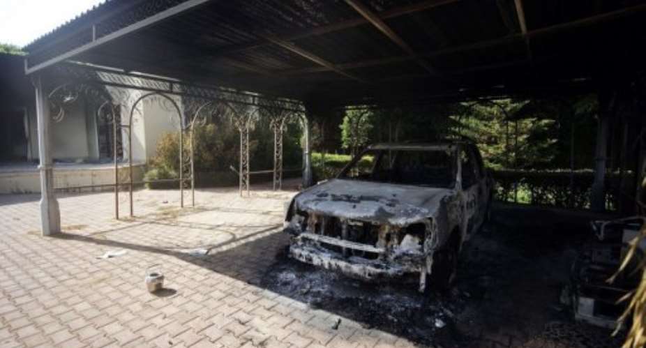 A picture shows a burnt vehicle inside the US consulate compound in Benghazi on September 13.  By Gianluigi Guercia AFPFile