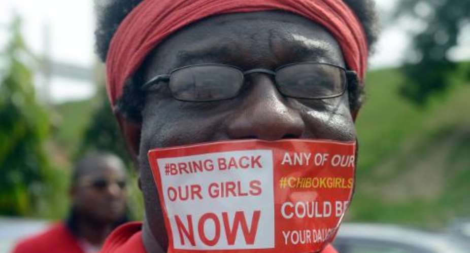 A man with a sticker reading Bring Back Our Girls Now campaigns for the release of the kidnapped Chibok schoolgirls during a rally in the Nigerian capital Abuja on October 14, 2014.  By Pius Utomi Ekpei AFPFile