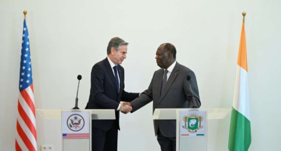 US Secretary of State Antony Blinken L met Ivorian President Alassane Ouattara R on the latest leg of a tour of African nations.  By ANDREW CABALLERO-REYNOLDS POOLAFP