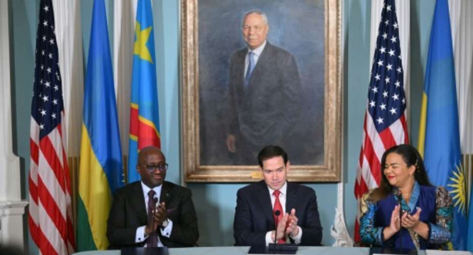 US Secretary of State Marco Rubio, Democratic Republic of the Congo Foreign Minister Therese Kayikwamba Wagner and Rwandan Foreign Minister Olivier Nduhungirehe applaud after signing a peace agreement in Washington.  By Mandel NGAN (AFP)