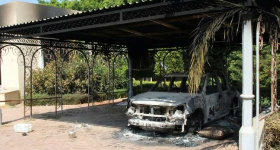 The wreckage of a car sits inside the US Embassy compound on September 12, 2012 in Benghazi, Libya, following an overnight attack on the building.  By  AFPFile