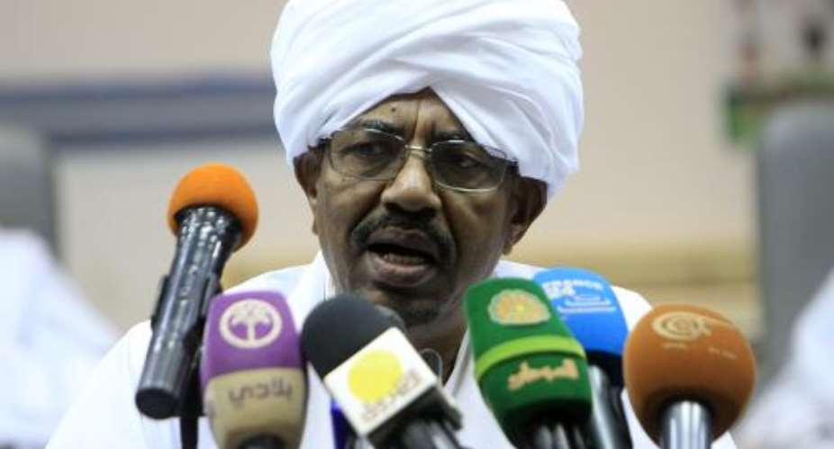 Sudan's President Omar al-Bashir addresses the National Consultative Council in the capital Khartoum on October 21, 2014.  By Ashraf Shazly AFP