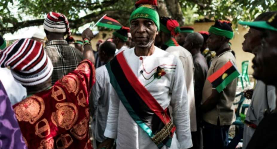 Veterans of the civil war, wearing the red, green and black flag of the secessionist state of Biafra, attend ceremonies to mark the conflict's 50th anniversary.  By MARCO LONGARI AFP