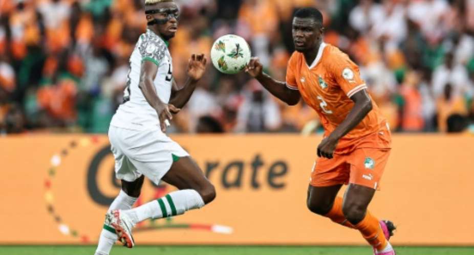 Victor Osimhen L in action for Nigeria against hosts Ivory Coast during the group stage.  By FRANCK FIFE AFPFile