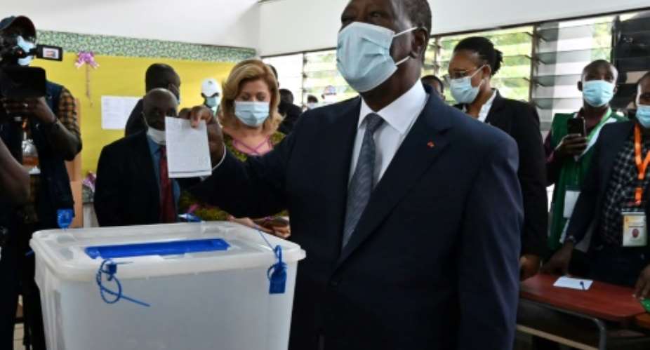 Victor: President Alassane Ouattara, casting his ballot in Abidjan on Saturday.  By Issouf SANOGO AFP