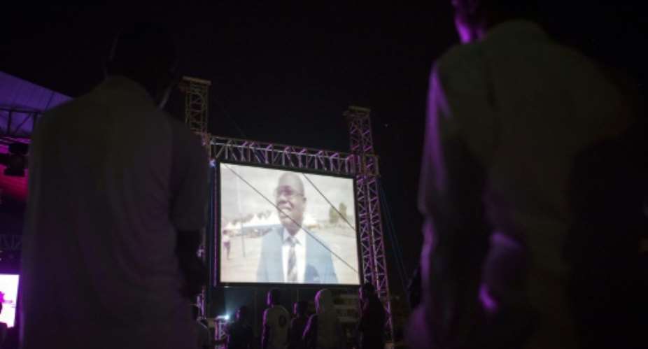 Viewers in Accra gather in June 2018 to watch a documentary that accused former Ghanian Football Association GFA president Kwesi Nyantakyi of soliciting millions of dollars in bribes.  By CRISTINA ALDEHUELA AFPFile