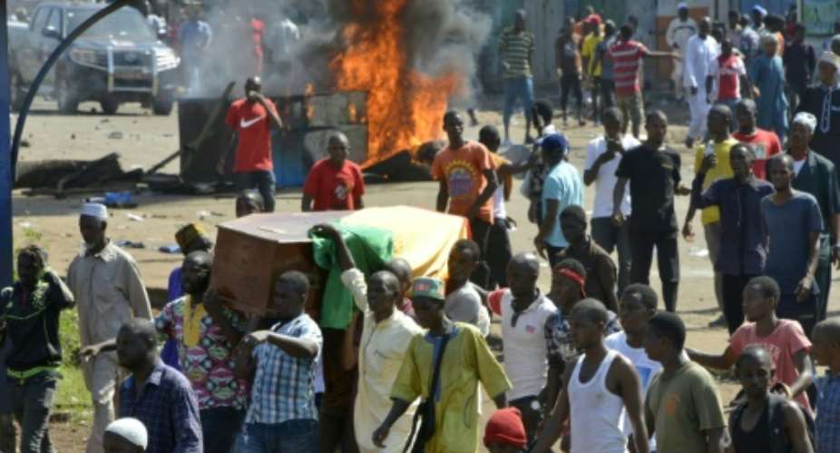 Violence erupted after hundreds marched in the capital Conakry to accompany coffins of people killed in more than a week of demonstrations.  By CELLOU BINANI AFP