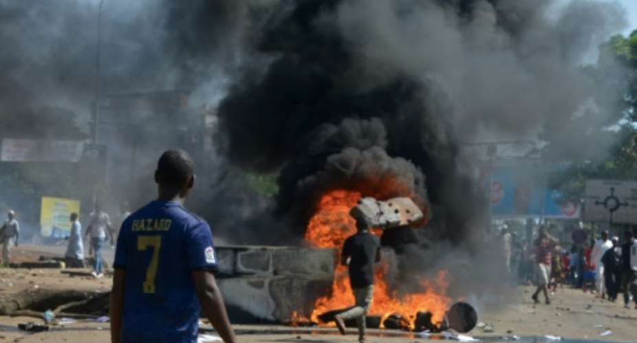Violent protests have erupted over President Alpha Conde's plans for constitutional change.  By CELLOU BINANI AFP