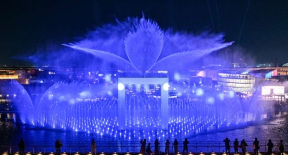 Visitors watch a water and light display during a media preview day for the 2025 Osaka Expo in Osaka on April 9, 2025.  By Richard A. Brooks (AFP)
