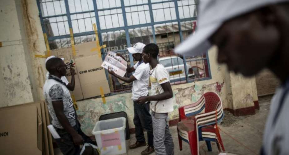 Electoral officials gather in the courtyard of the administrative building of the Bwiza district of Bujumbura, where ballots are counted on June 29, 2015.  By Marco Longari AFPFile