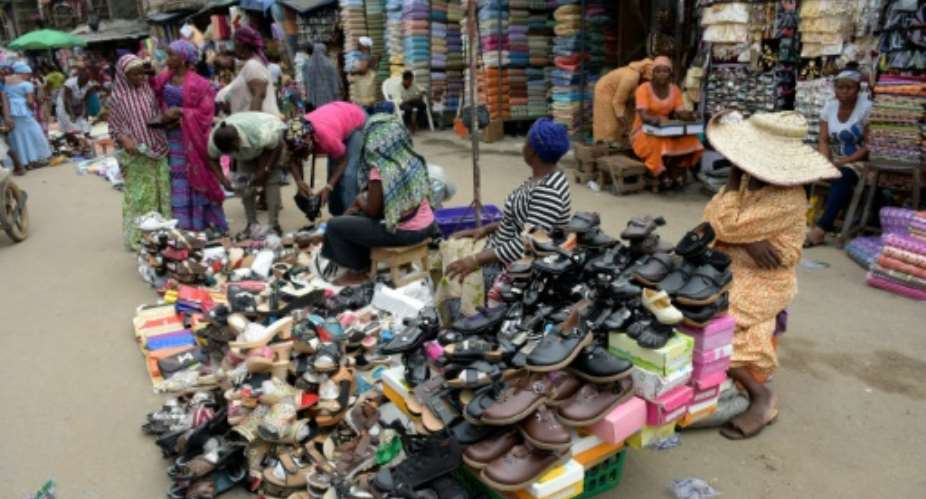 Vendors display their wares at Oshodi market in Lagos, on February 25, 2015.  By Pius Utomi Ekpei AFPFile