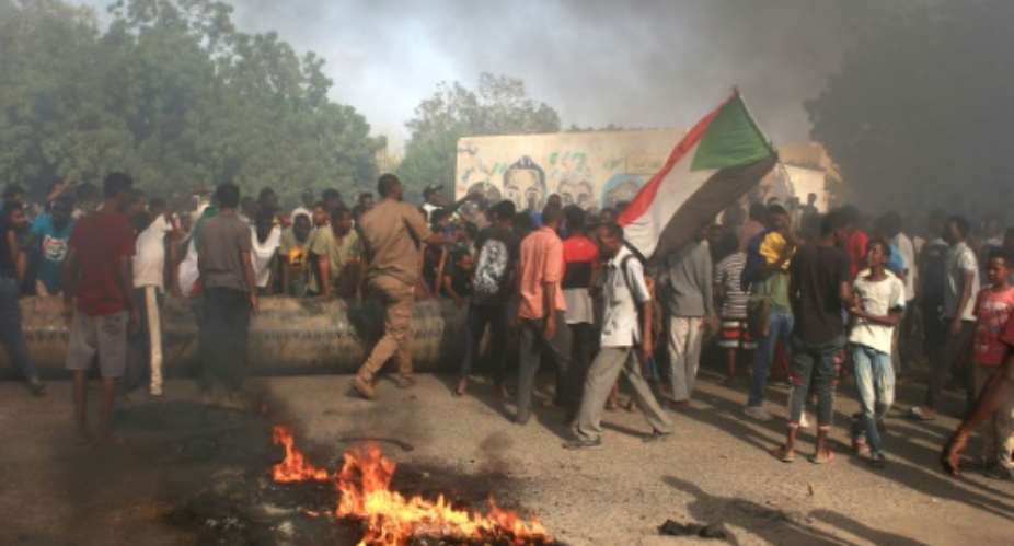 Washington said it was pausing US aid to Sudan after a military takeover in the African nation, where civilians have taken to the streets in protest of the ouster of civilian leaders.  By - AFP