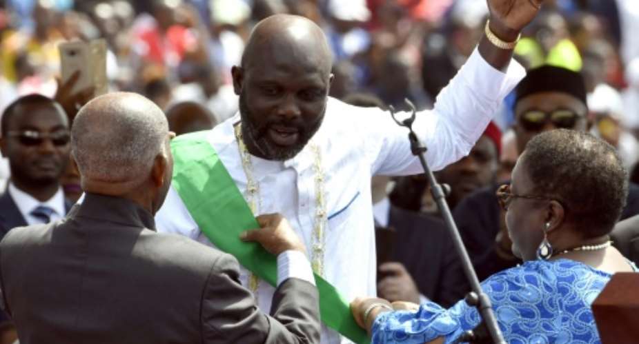 Weah's inauguration on Monday marked Liberia's first transition between democratically-elected leaders in three generations.  By ISSOUF SANOGO AFP