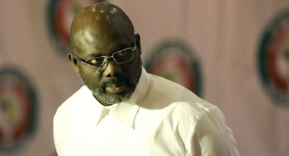Weah's office said he penned the lyrics himself.  By Kola SULAIMON AFPFile