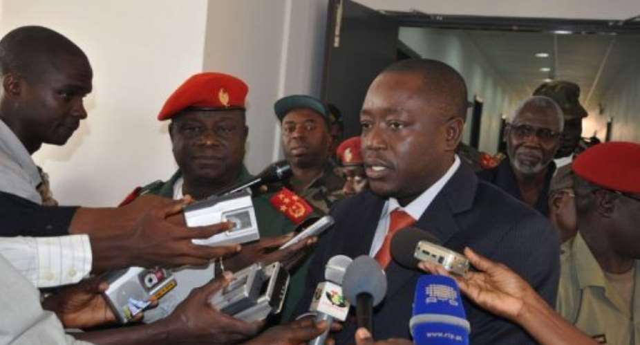 Guinea-Bissaus Chief of Staff of Armed Forces General Antonio Indjai (2nd L) and Minister of Defense, Baciro Dja (C).  By Vladimir Monteiro (AFP/UN/File)