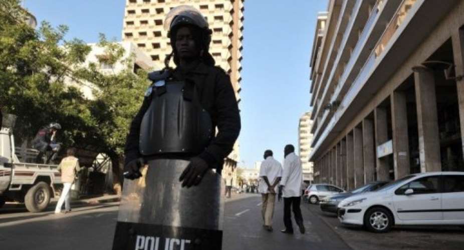 Senegalese police block the acces to the city center of Dakar.  By Issouf Sanogo AFPFile
