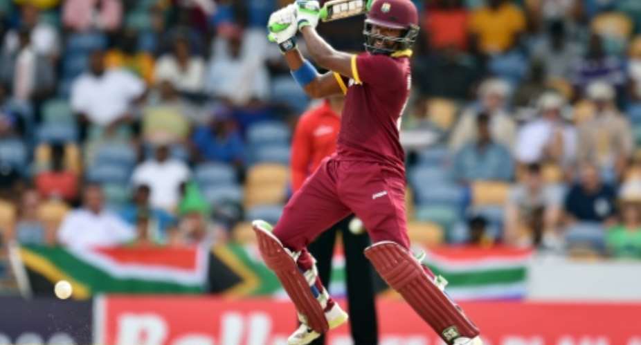 West Indies' Darren Bravo plays a shot during their 9th ODI match of the Tri-nation Series, against South Africa, at Kensington Oval in Bridgetown, on June 24, 2016.  By Jewel Samad AFP