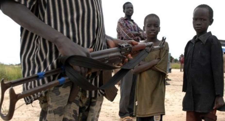 A resident of Duk Padiet in south Sudans Jonglei state holds a gun on September 22, 2009.  By Tim Mckulka (UNMIS/AFP/File)