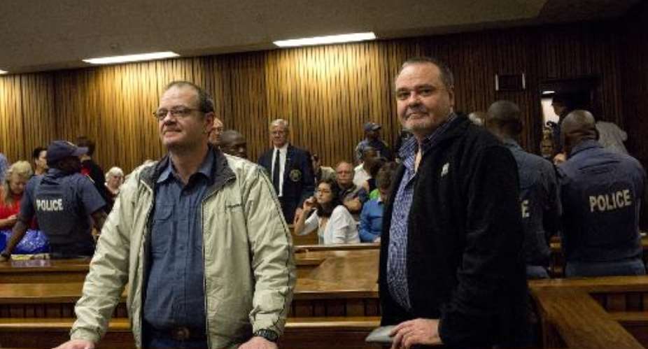 Mike R and Andre du Toit attend their trial at Pretoria High Court on October 29, 2013.  By Alexander Joe AFP