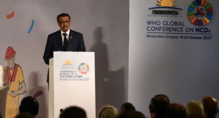 WHO head Tedros Adhanom Ghebreyesus had praised Zimbabwe's health coverage -- but announced a rethink after critics observed its president tends to get his treatment abroad.  By MIGUEL ROJO AFP