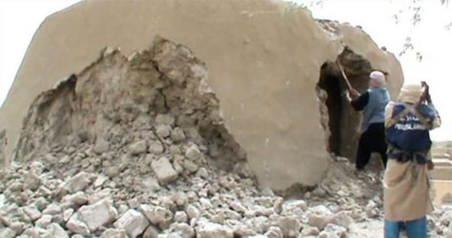 A still from a video shows Islamist militants destroying an ancient shrine in Timbuktu on July 1.  By  AFPFile