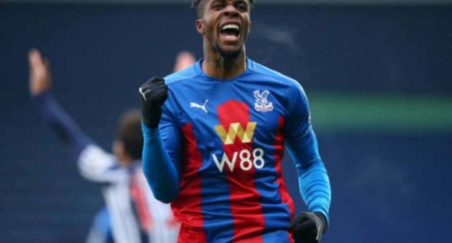 Wilfried Zaha celebrates the first Crystal Palace goal in a 5-1 triumph over West Bromwich Albion at the weekend.  By Alex Livesey (POOL/AFP)