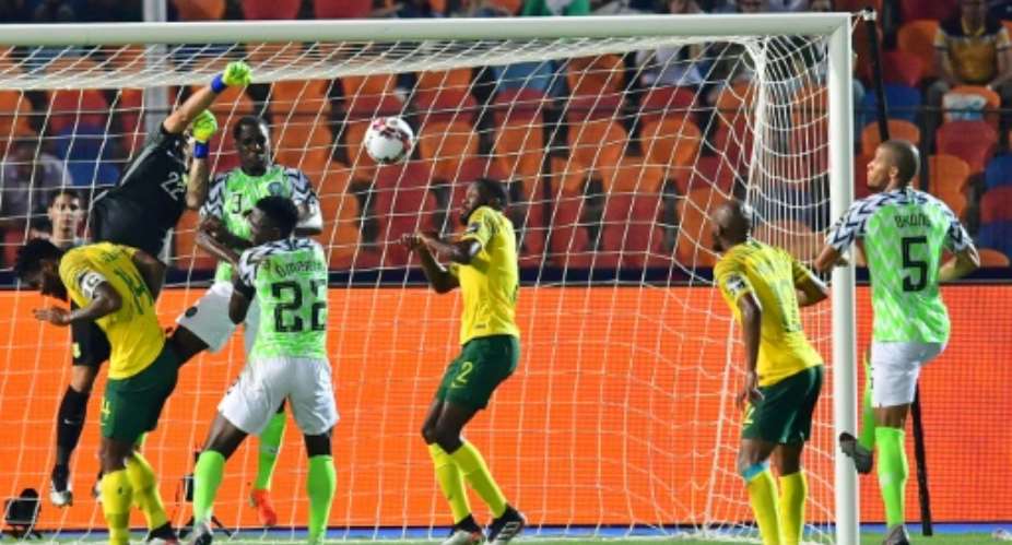 William Troost-Ekong R pounced after South Africa goalkeeper Ronwen Williams failed to deal with a corner.  By Giuseppe CACACE AFP